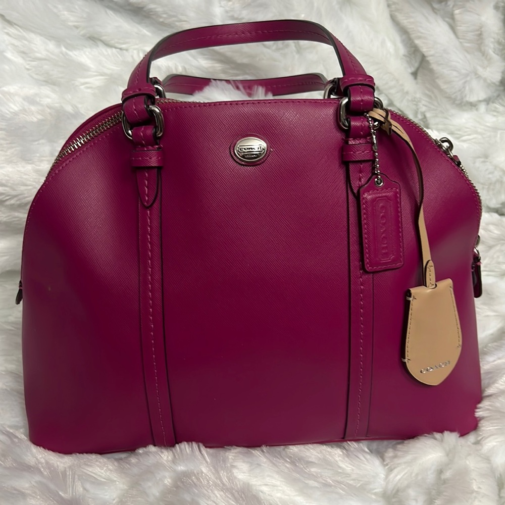 Fushia coach purse.